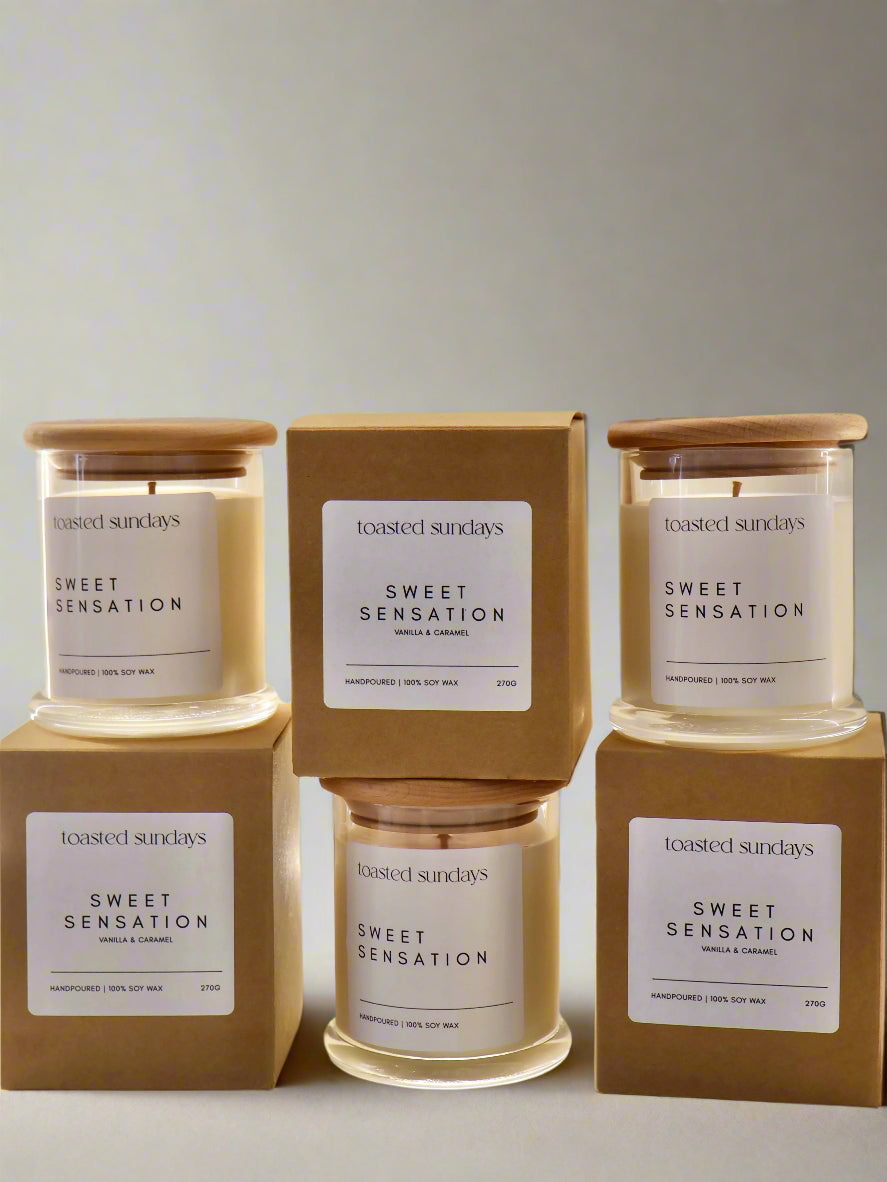  'Sweet Sensation' candles by 'toasted sundays' on a neutral background